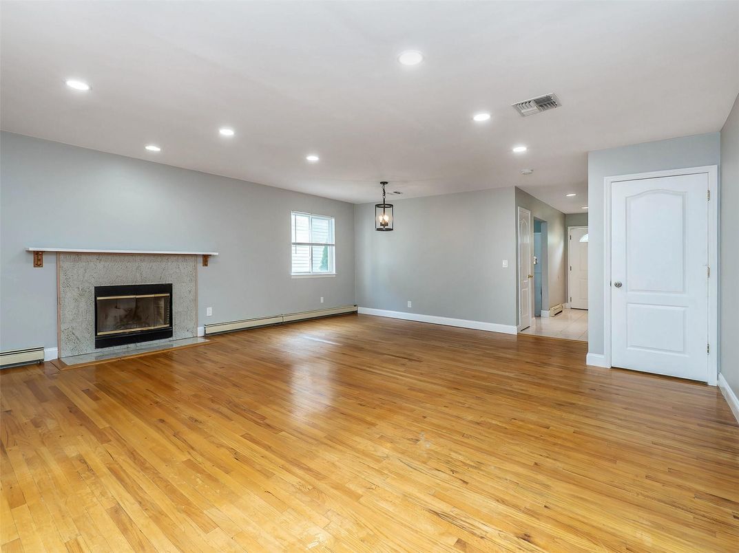 Empty room, Fireplace, Interior, Pendant Lights, Recessed Lighting, Wood Texture Flooring