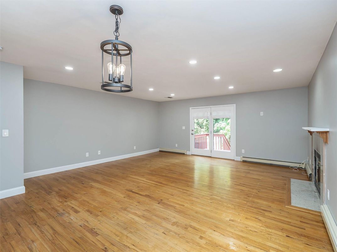 Empty room, Fireplace, Interior, Pendant Lights, Recessed Lighting, Wood Texture Flooring