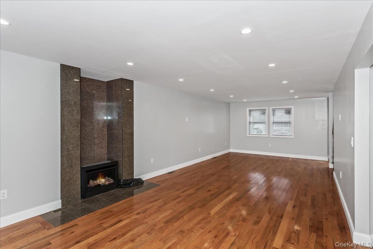 Empty room, Fireplace, Interior, Recessed Lighting, Wood Texture Flooring