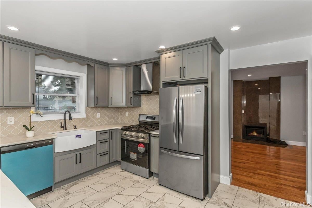 Fireplace, Interior, Kitchen, Marble, Recessed Lighting, Stainless Steel Appliances, Wood Texture Flooring