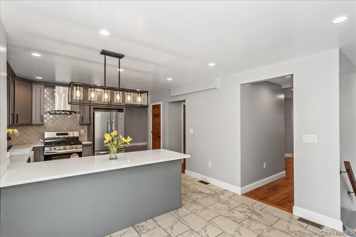 Interior, Kitchen, Marble, Pendant Lights, Recessed Lighting, Stainless Steel Appliances, Wood Texture Flooring