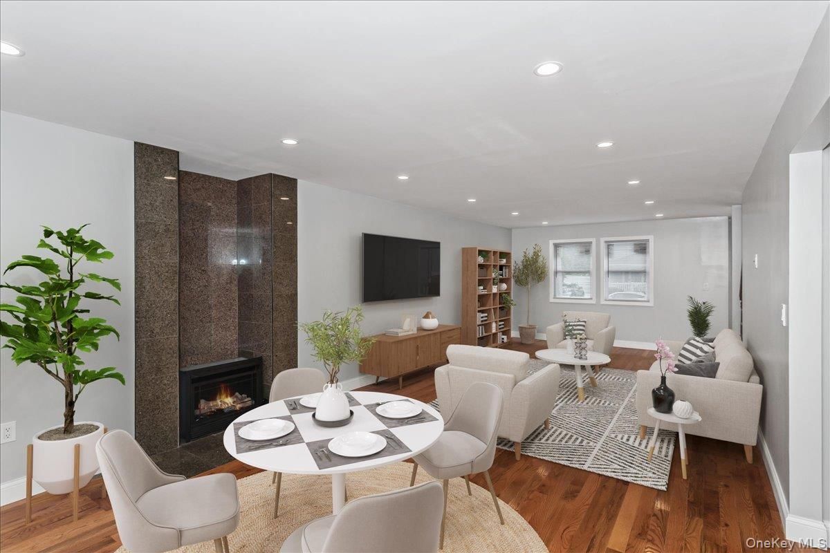 Dining room, Fireplace, Interior, Living room, Recessed Lighting, Wood Texture Flooring