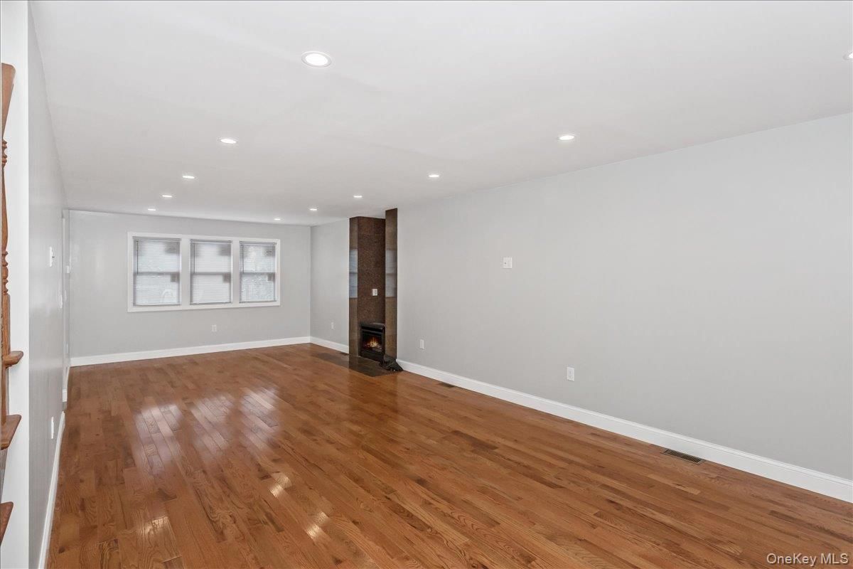 Empty room, Fireplace, Interior, Recessed Lighting, Wood Texture Flooring