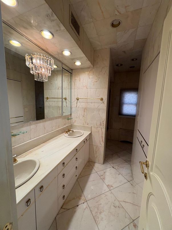 Bathroom, Chandelier, Dual Sink Vanities, Interior, Marble, Marble Walls, Recessed Lighting
