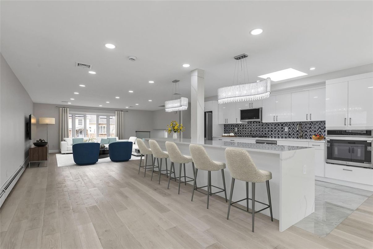 Chandelier, Dining room, Interior, Kitchen, Living room, Pendant Lights, Recessed Lighting, Stainless Steel Appliances, Wood Texture Flooring