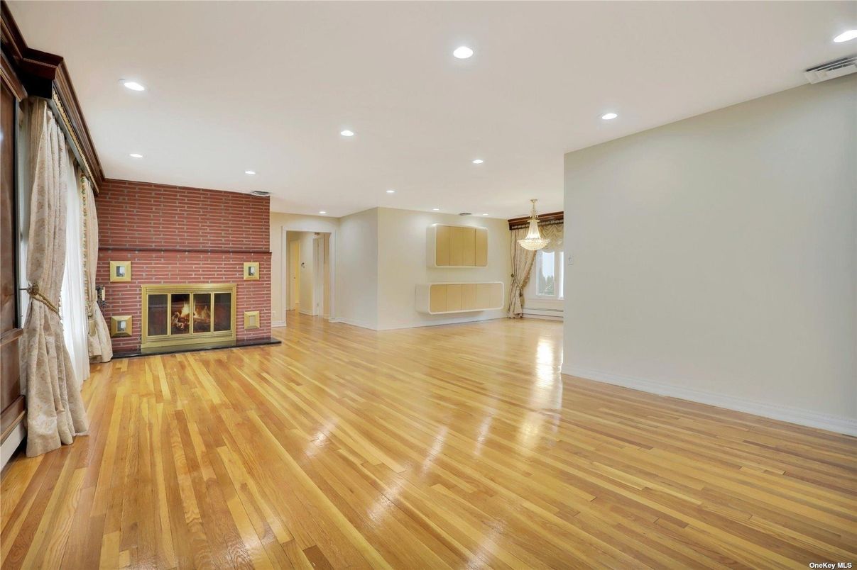Empty room, Fireplace, Interior, Recessed Lighting, Stone Walls, Wood Texture Flooring