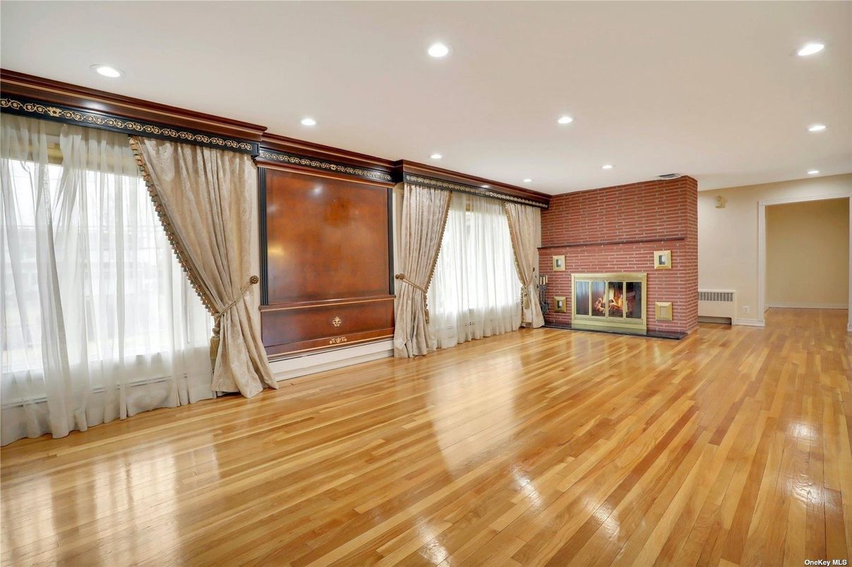 Empty room, Fireplace, Interior, Recessed Lighting, Stone Walls, Wood Texture Flooring