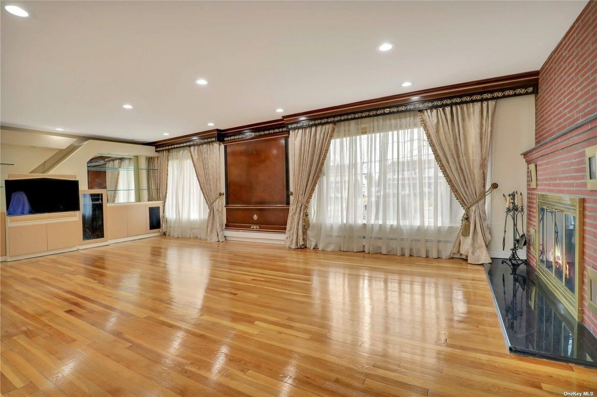 Empty room, Fireplace, Interior, Recessed Lighting, Stone Walls, Wood Texture Flooring