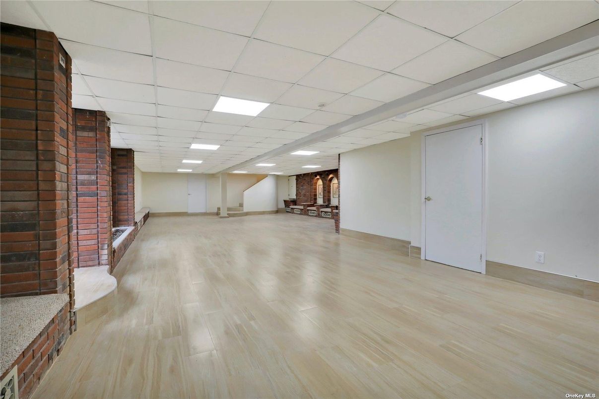 Empty room, Fireplace, Interior, Recessed Lighting, Stone Walls, Wood Texture Flooring