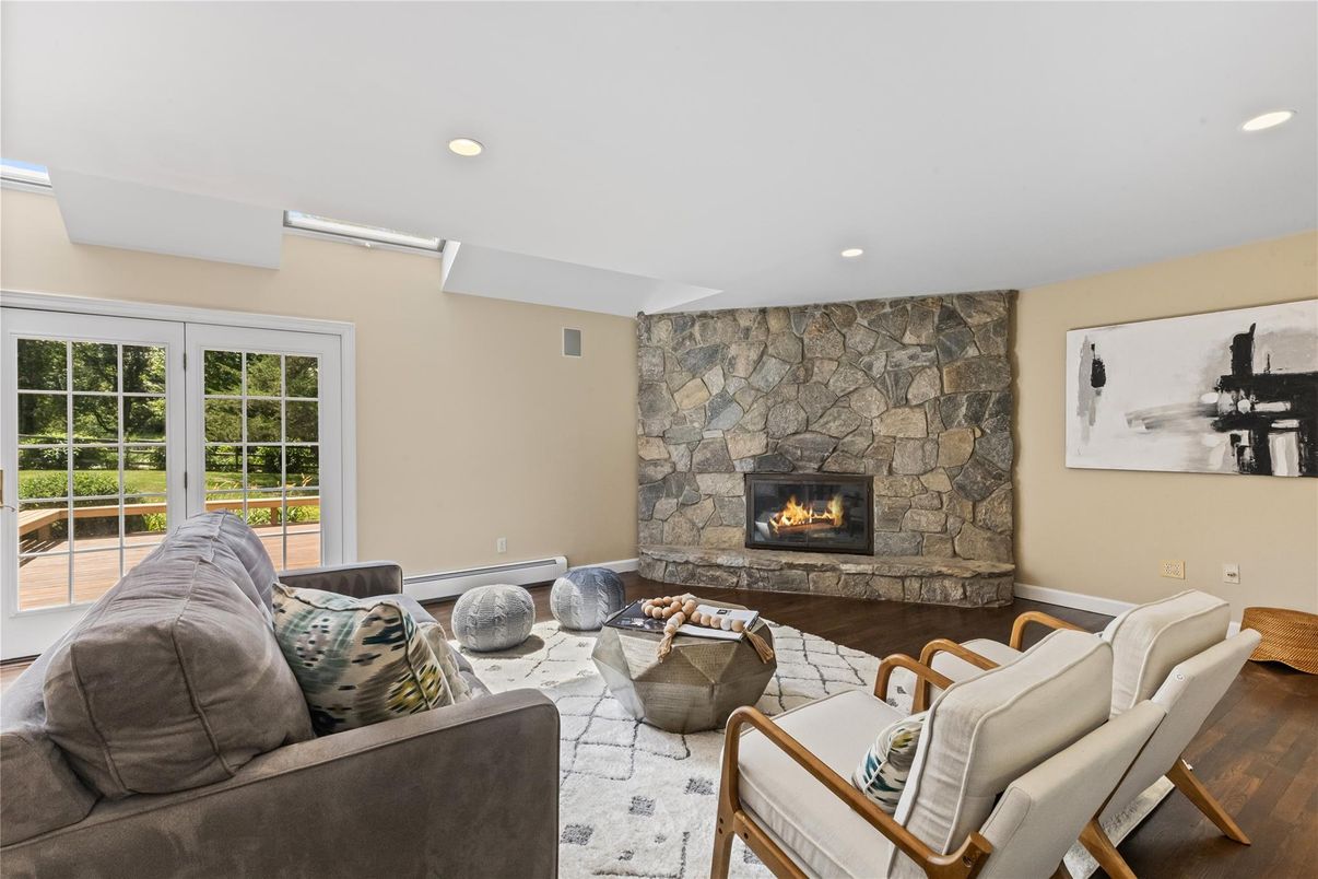 Fireplace, Interior, Living room, Recessed Lighting, Stone Walls, Wood Texture Flooring