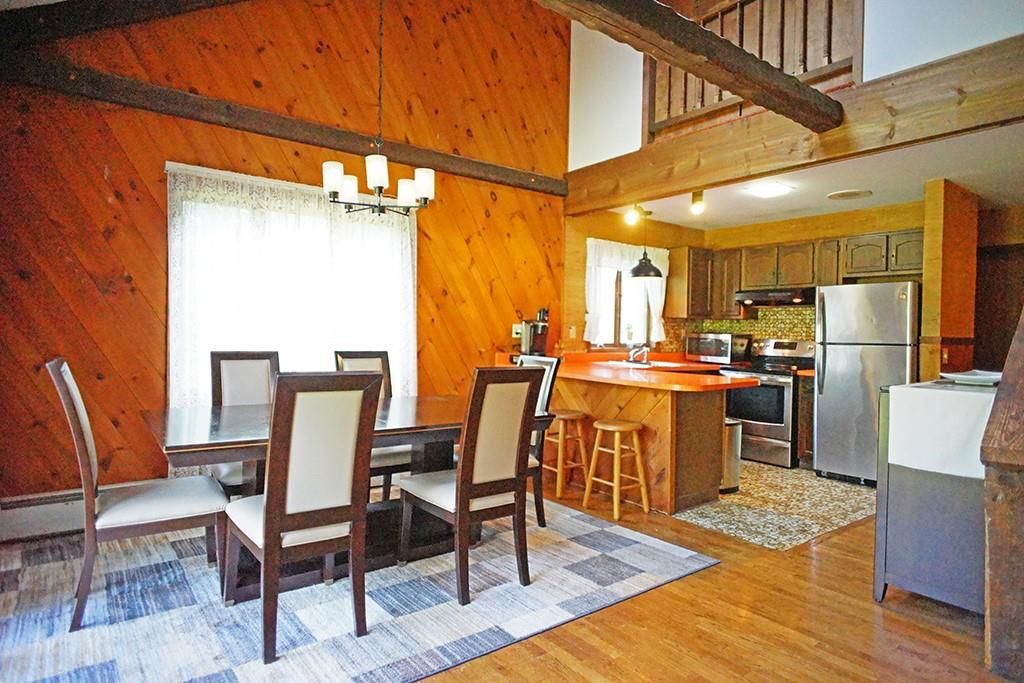 Dining room, Interior, Kitchen, Pendant Lights, Stainless Steel Appliances, Wooden Beams, Wood Texture Flooring, Wooden Walls