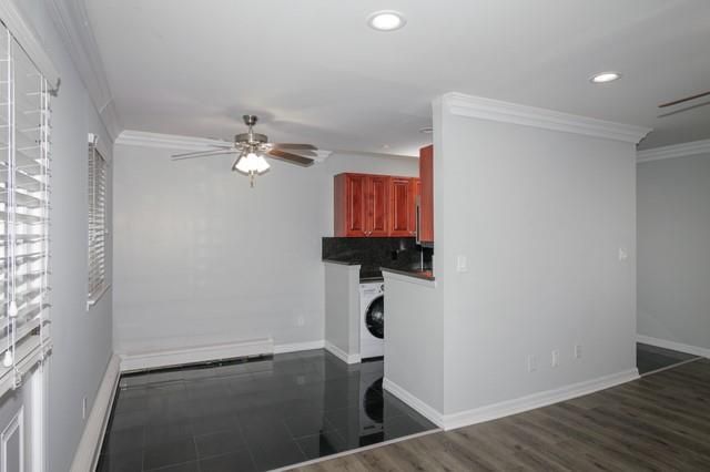 Empty room, Interior, Kitchen, Recessed Lighting, Washer, Wood Texture Flooring