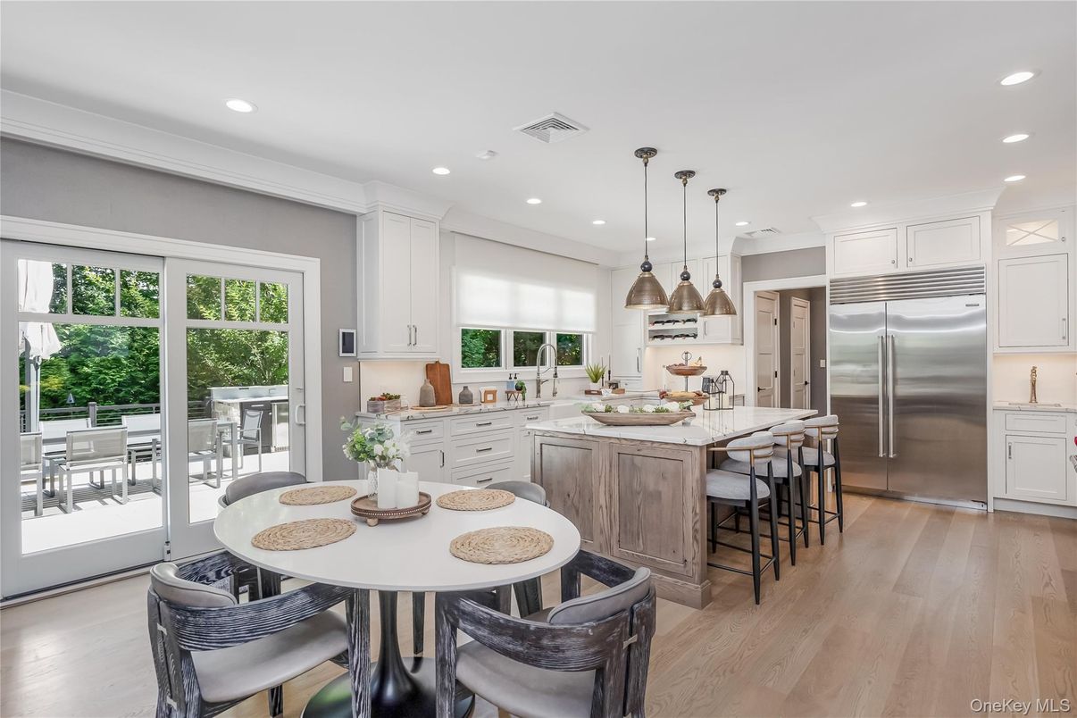 Dining room, Interior, Kitchen, Pendant Lights, Recessed Lighting, Stainless Steel Appliances, Wood Texture Flooring