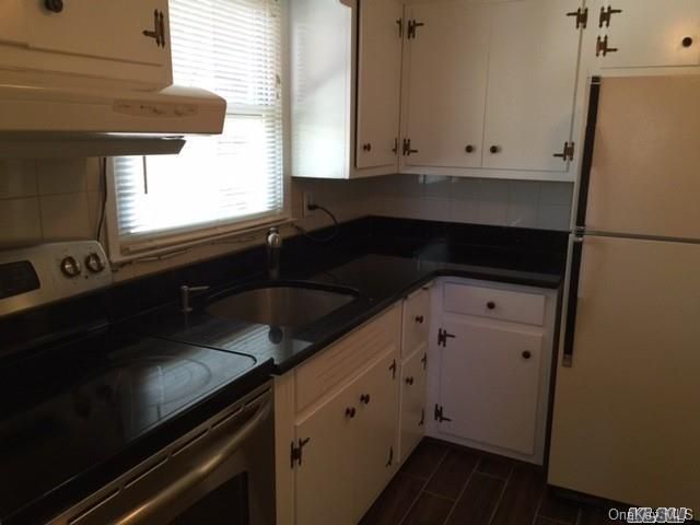 Interior, Kitchen, Tile Countertops, Wood Texture Flooring