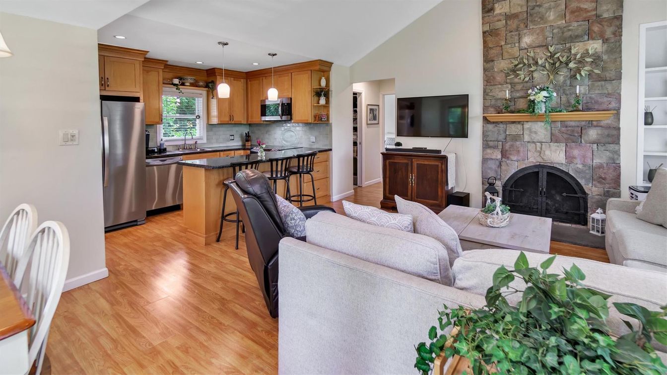 Fireplace, Interior, Kitchen, Living room, Pendant Lights, Recessed Lighting, Stainless Steel Appliances, Stone Walls, Wood Texture Flooring
