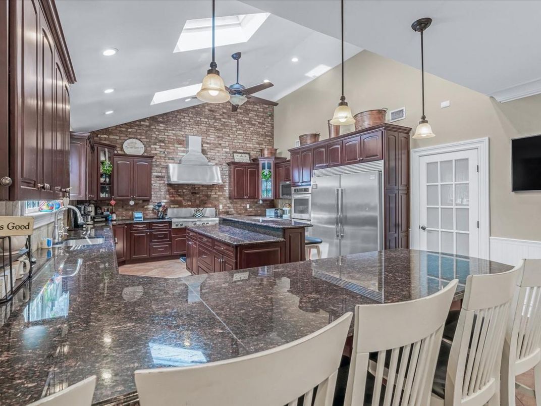 Interior, Kitchen, Pendant Lights, Recessed Lighting, Stainless Steel Appliances, Stone Walls