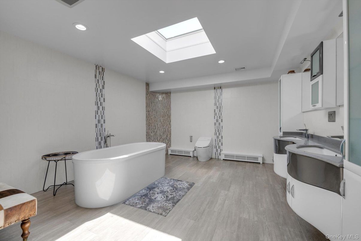 Bathroom, Dual Sink Vanities, Free Standing Baths, Interior, Recessed Lighting, Wood Texture Flooring