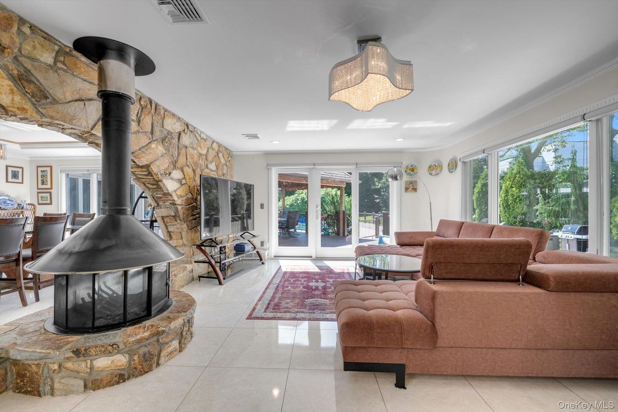 Dining room, Fireplace, Interior, Living room, Recessed Lighting, Stone Walls