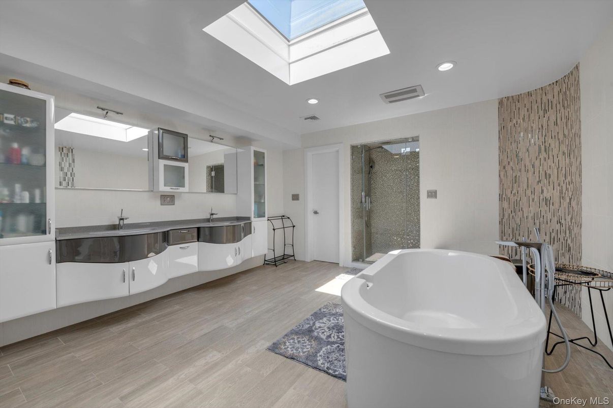 Bathroom, Free Standing Baths, Glass Shower, Interior, Recessed Lighting, Wood Texture Flooring