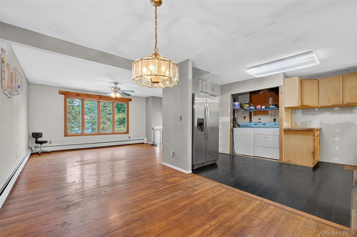 Empty room, Interior, Kitchen, Pendant Lights, Stainless Steel Appliances, Wood Texture Flooring
