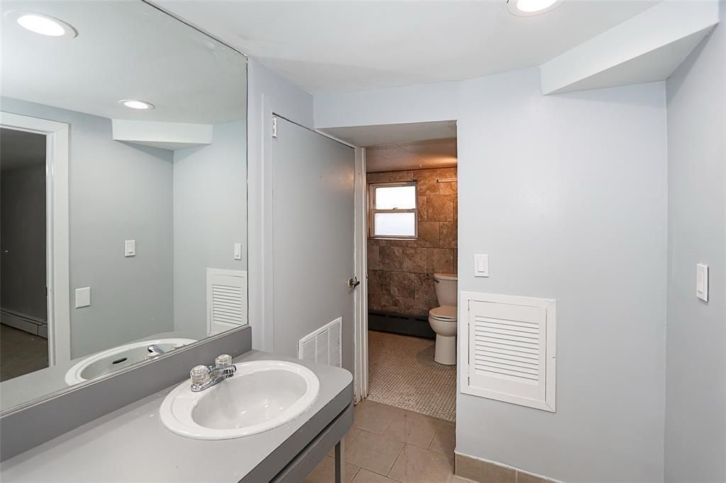 Bathroom, Dual Sink Vanities, Interior, Recessed Lighting, Wooden Walls