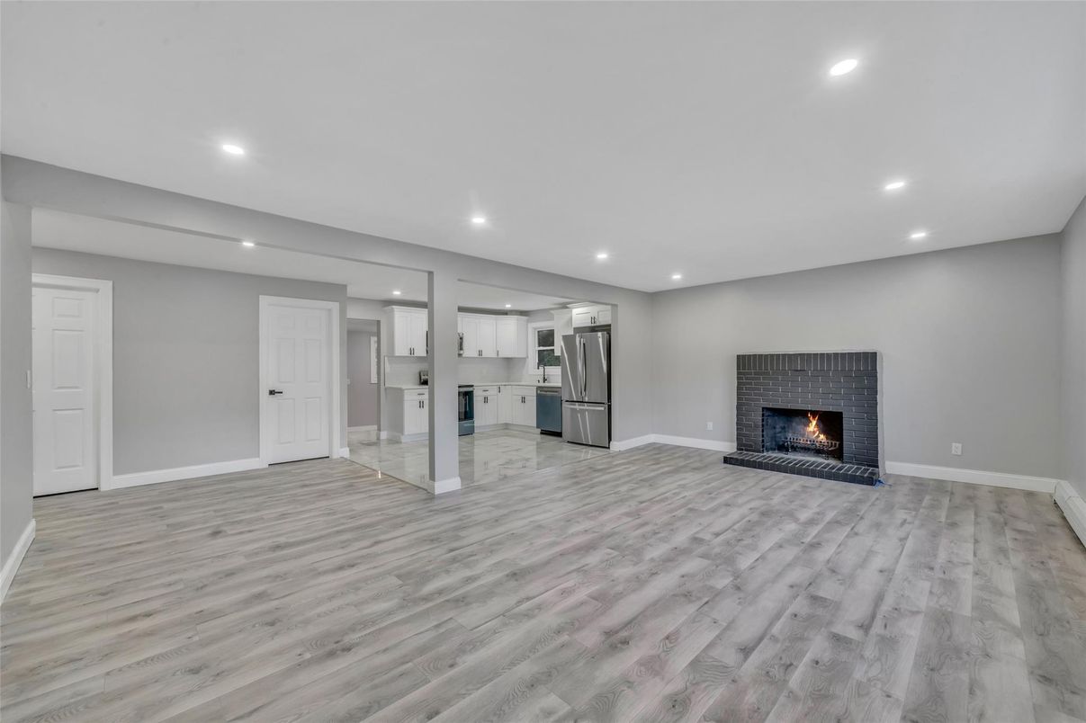 Empty room, Fireplace, Interior, Kitchen, Recessed Lighting, Wood Texture Flooring