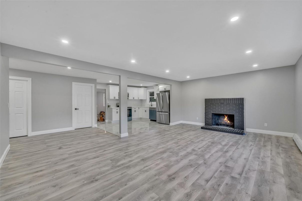 Empty room, Fireplace, Interior, Kitchen, Recessed Lighting, Wood Texture Flooring
