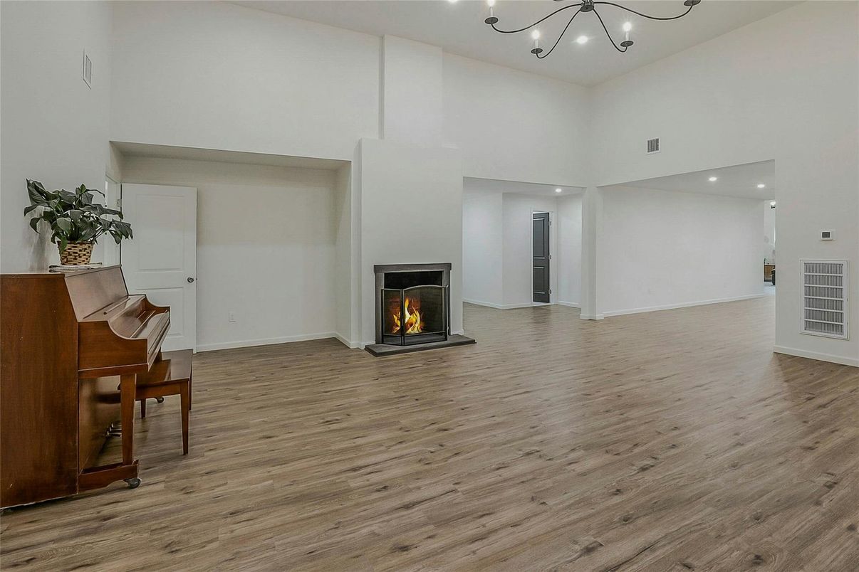 Fireplace, Interior, Piano, Recessed Lighting, Wood Texture Flooring