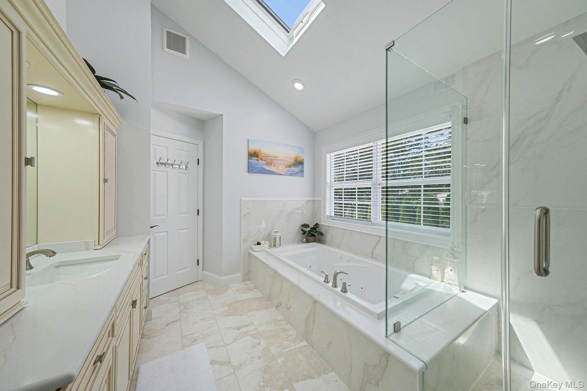 Bathroom, Dual Sink Vanities, Glass Shower, Interior, Marble Walls, Recessed Lighting