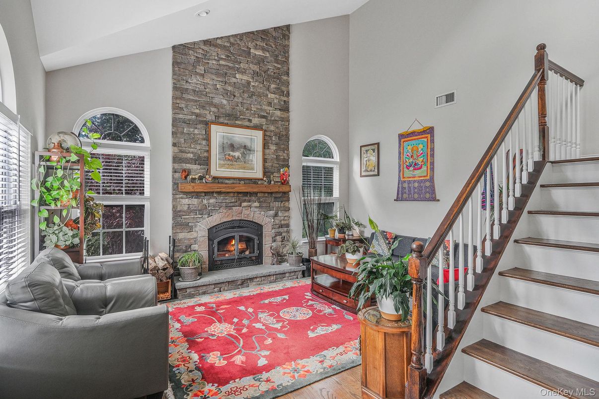 Fireplace, Interior, Living room, Recessed Lighting, Stone Walls, Wood Texture Flooring