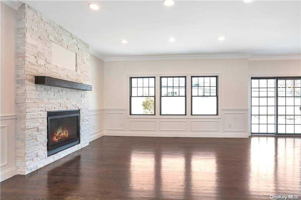 Empty room, Fireplace, Interior, Recessed Lighting, Stone Walls, Wood Texture Flooring