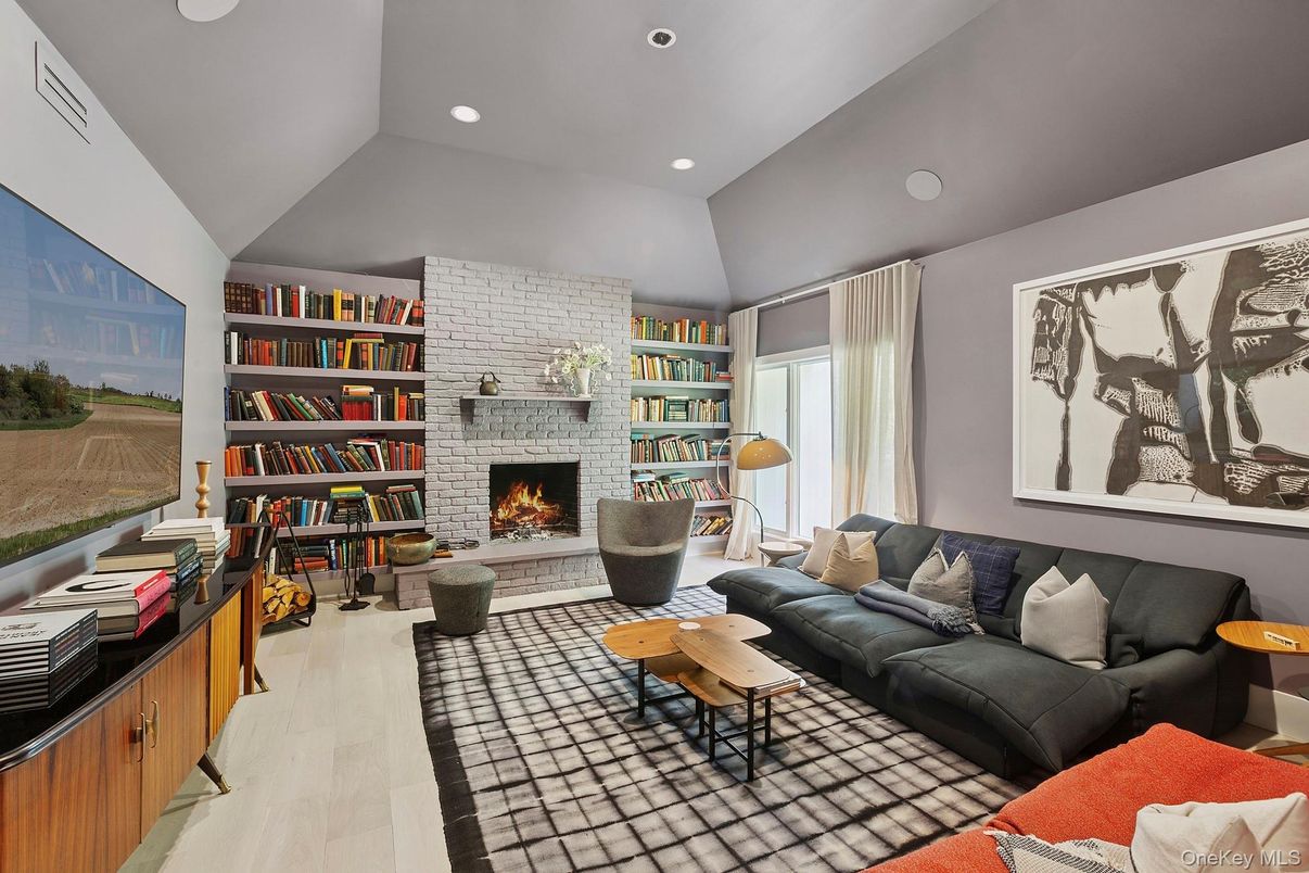 Fireplace, Interior, Living room, Recessed Lighting, Stone Walls, Wood Texture Flooring