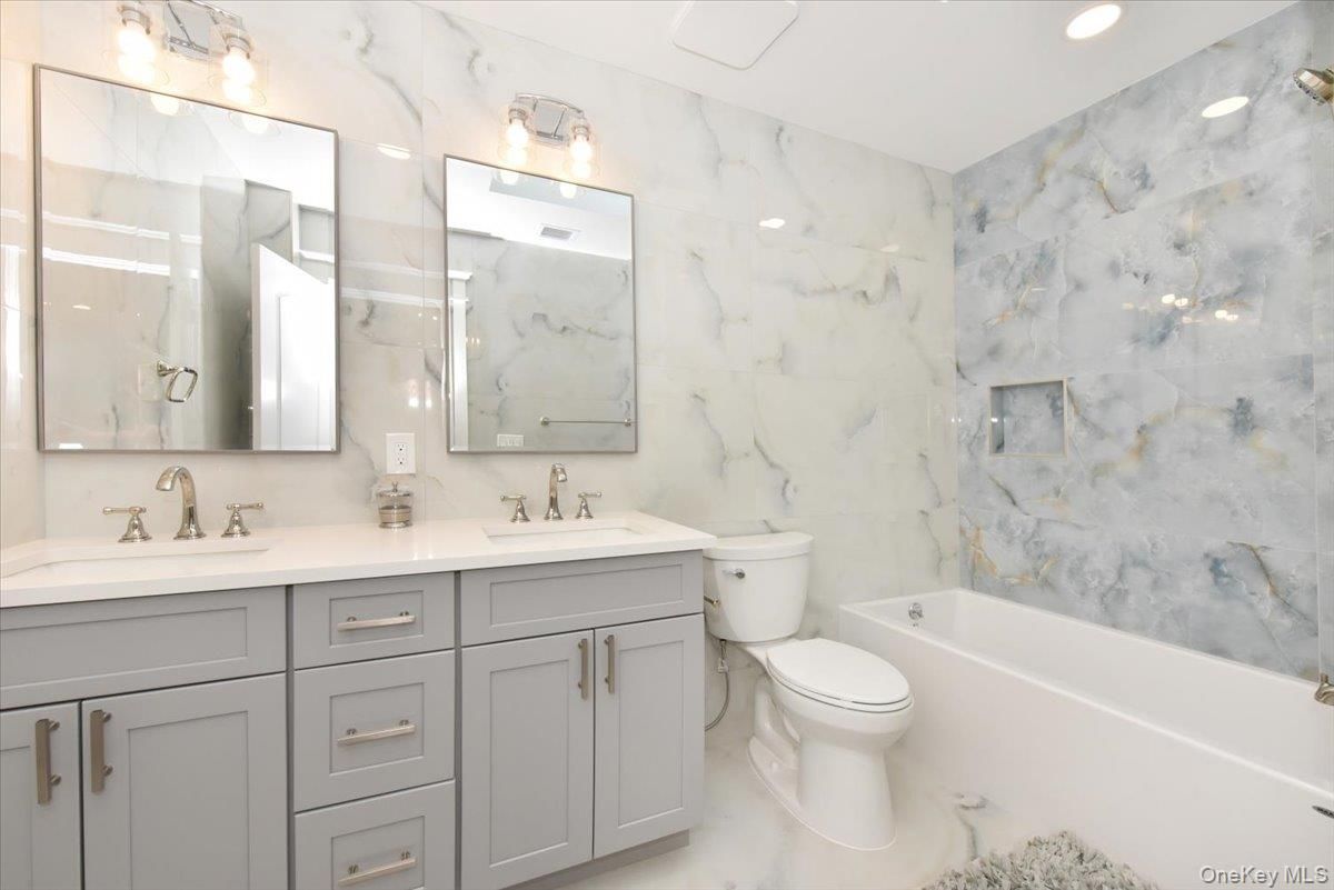 Bathroom, Dual Sink Vanities, Interior, Marble Walls, Recessed Lighting