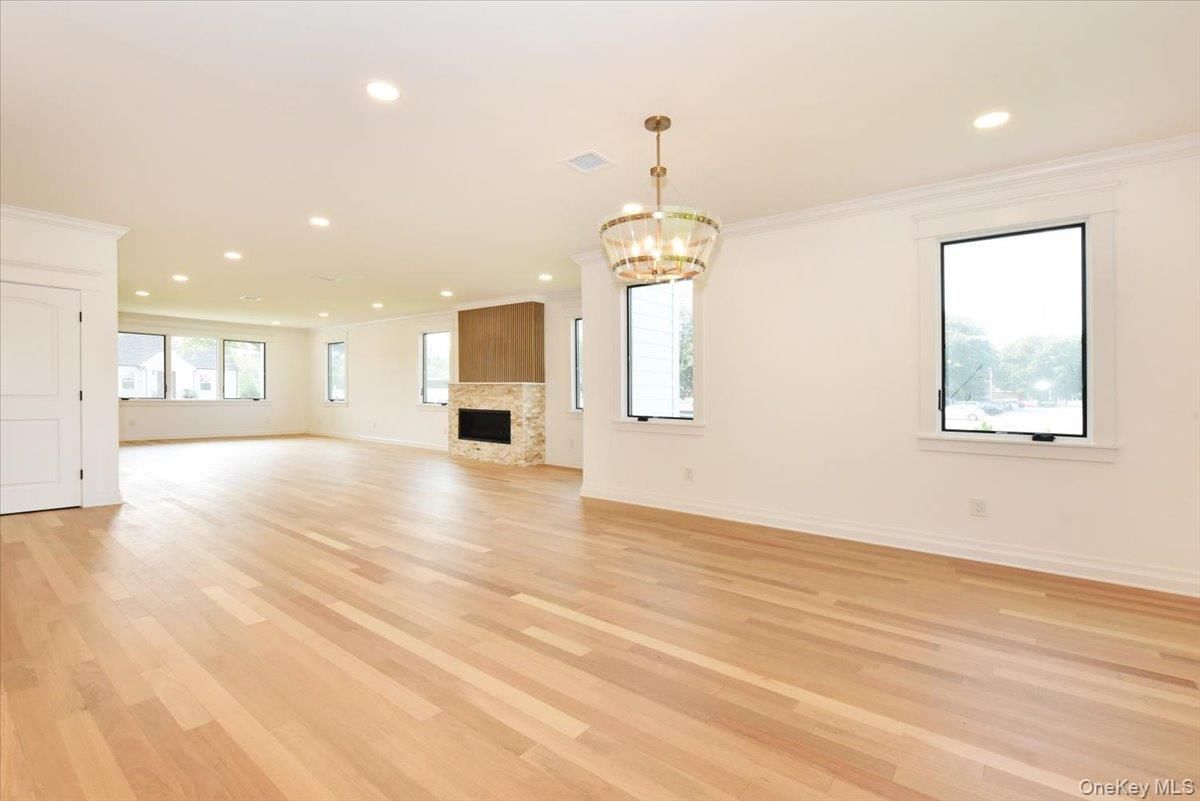 Chandelier, Empty room, Fireplace, Interior, Pendant Lights, Recessed Lighting, Wood Texture Flooring