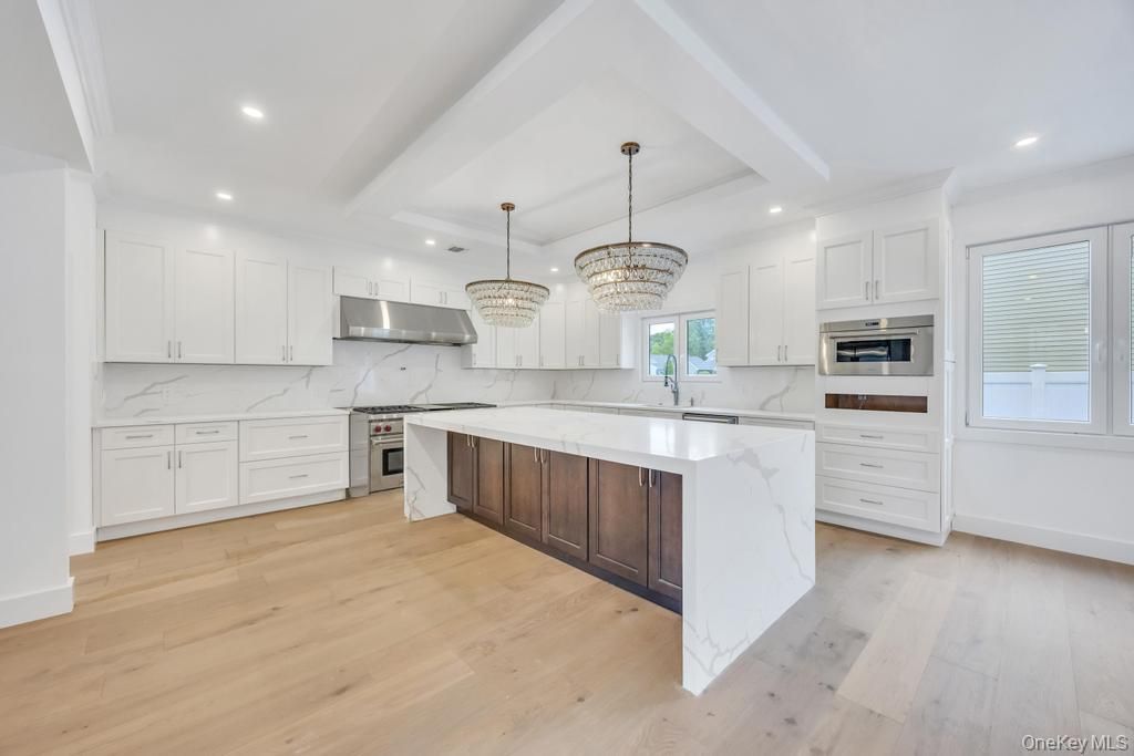 Chandelier, Interior, Kitchen, Marble Walls, Recessed Lighting, Stainless Steel Appliances, Wood Texture Flooring
