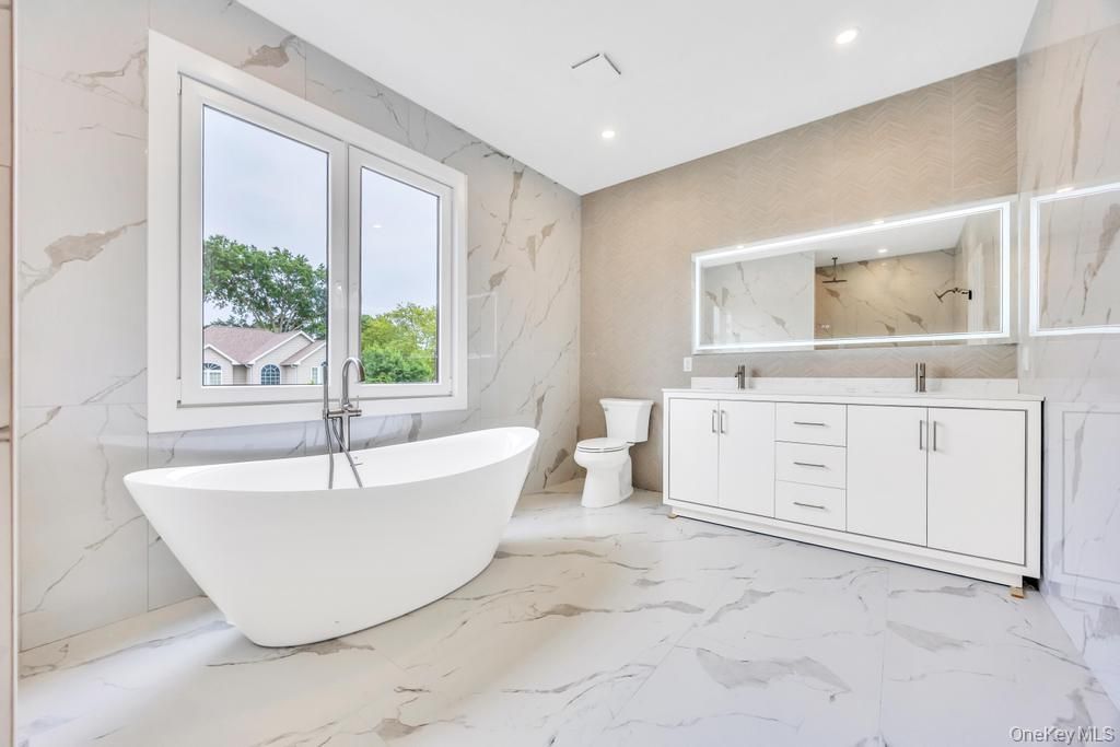 Bathroom, Dual Sink Vanities, Free Standing Baths, Interior, Marble, Marble Walls, Recessed Lighting