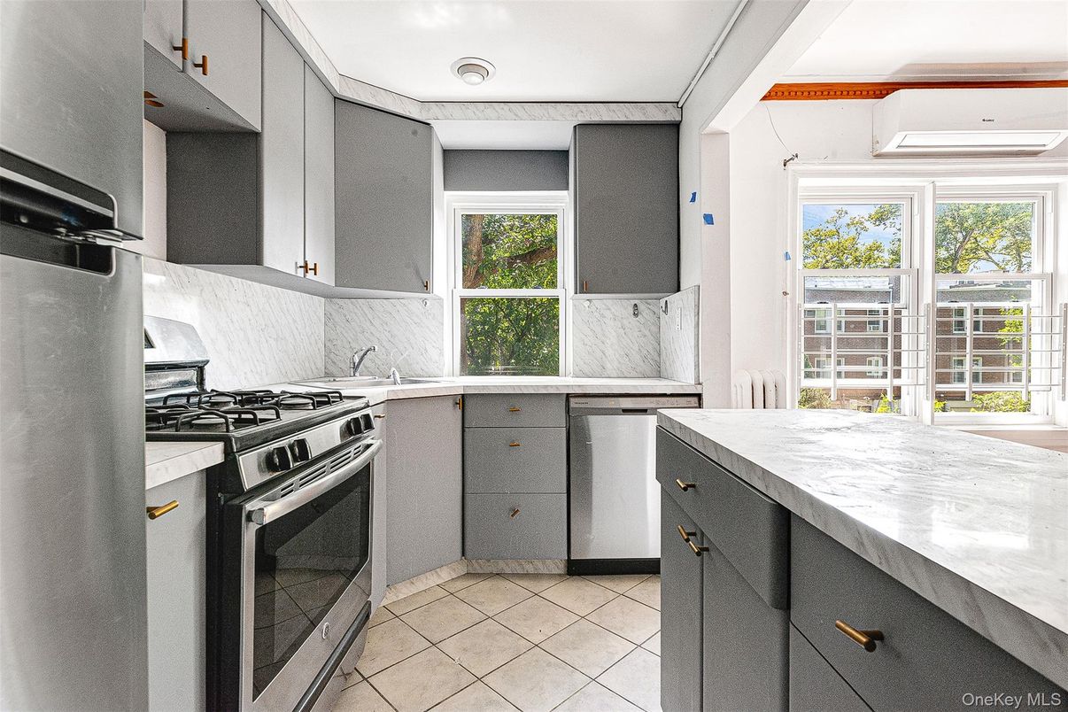 Interior, Kitchen, Marble Walls, Recessed Lighting, Stainless Steel Appliances