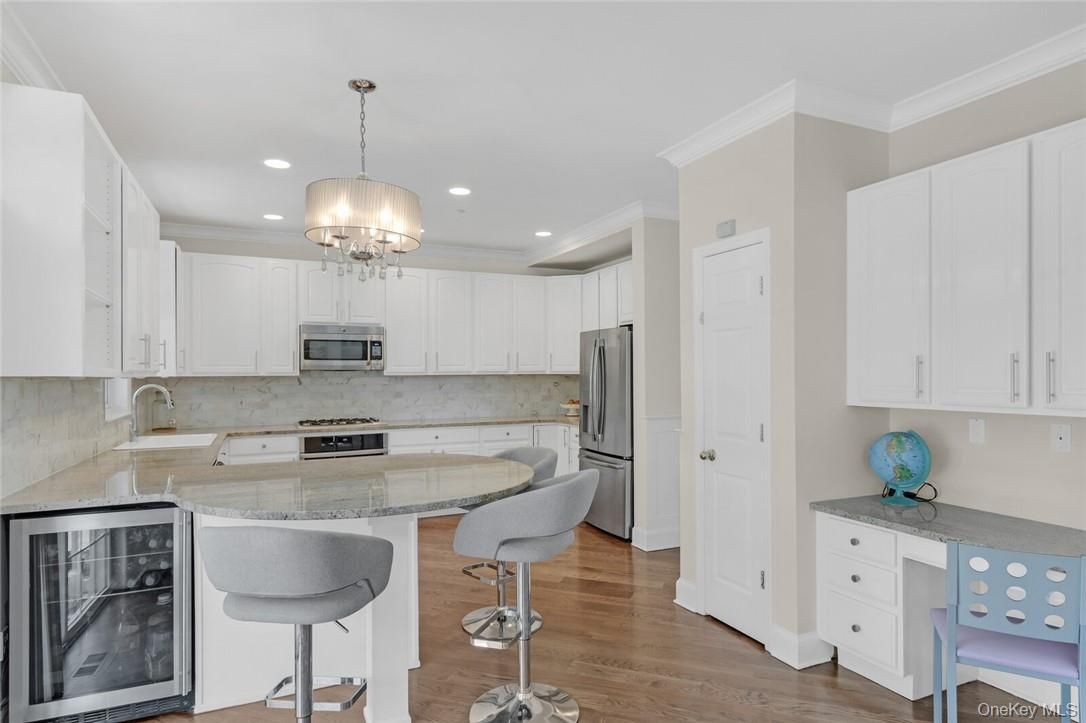 Chandelier, Interior, Kitchen, Pendant Lights, Recessed Lighting, Stainless Steel Appliances, Wood Texture Flooring