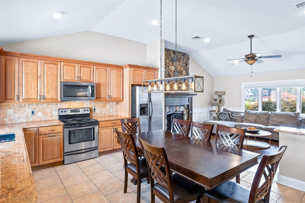 Dining room, Fireplace, Interior, Kitchen, Pendant Lights, Recessed Lighting, Stainless Steel Appliances
