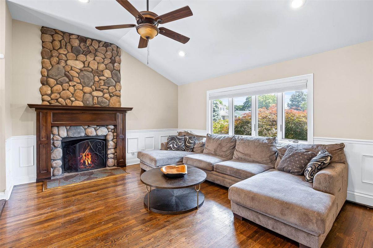 Fireplace, Interior, Living room, Recessed Lighting, Stone Walls, Wood Texture Flooring