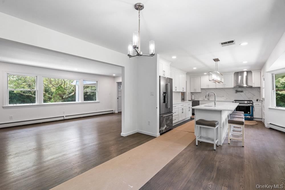 Interior, Kitchen, Marble Walls, Pendant Lights, Recessed Lighting, Stainless Steel Appliances, Wood Texture Flooring