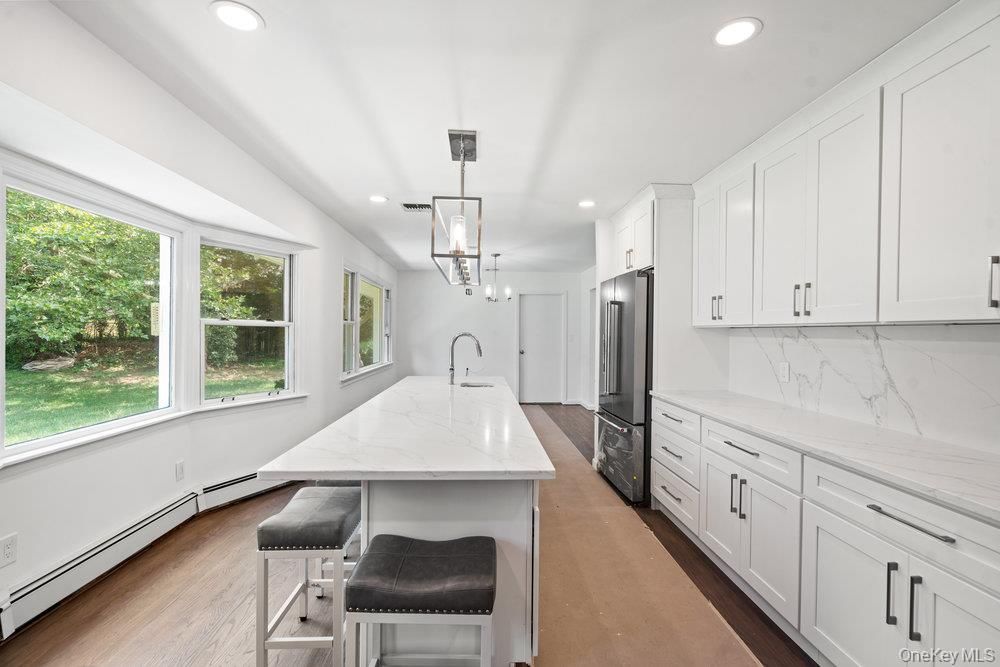 Interior, Kitchen, Marble Walls, Pendant Lights, Recessed Lighting, Stainless Steel Appliances, Wood Texture Flooring