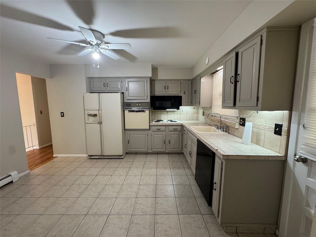 Interior, Kitchen, Tile Countertops, Wood Texture Flooring