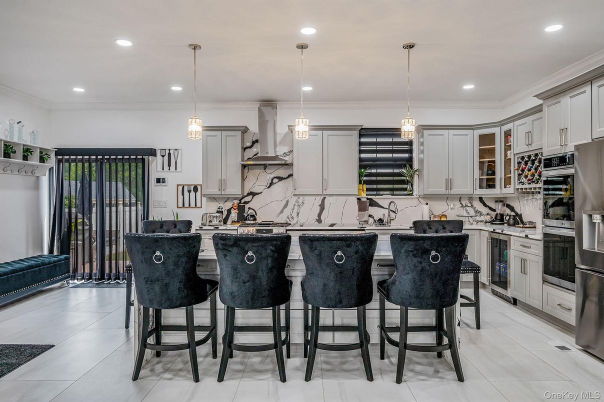 Interior, Kitchen, Marble Walls, Pendant Lights, Recessed Lighting, Stainless Steel Appliances
