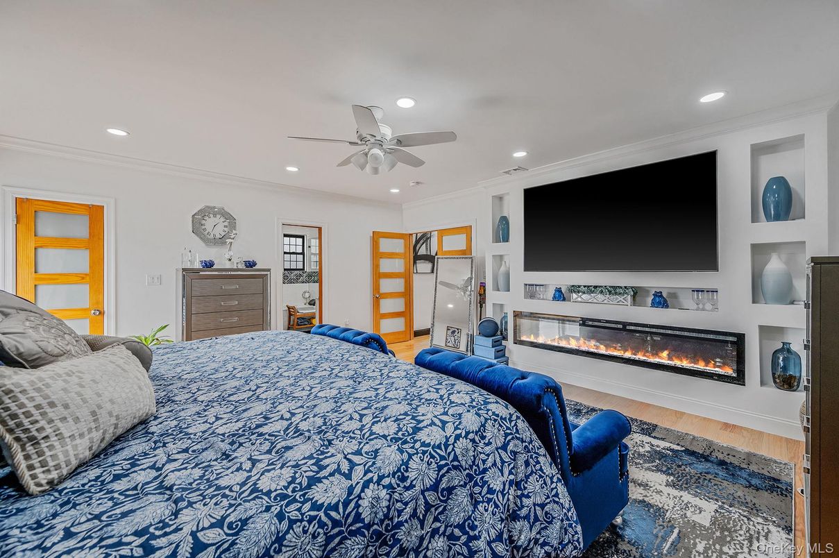 Bedroom, Fireplace, Interior, Recessed Lighting, Wood Texture Flooring