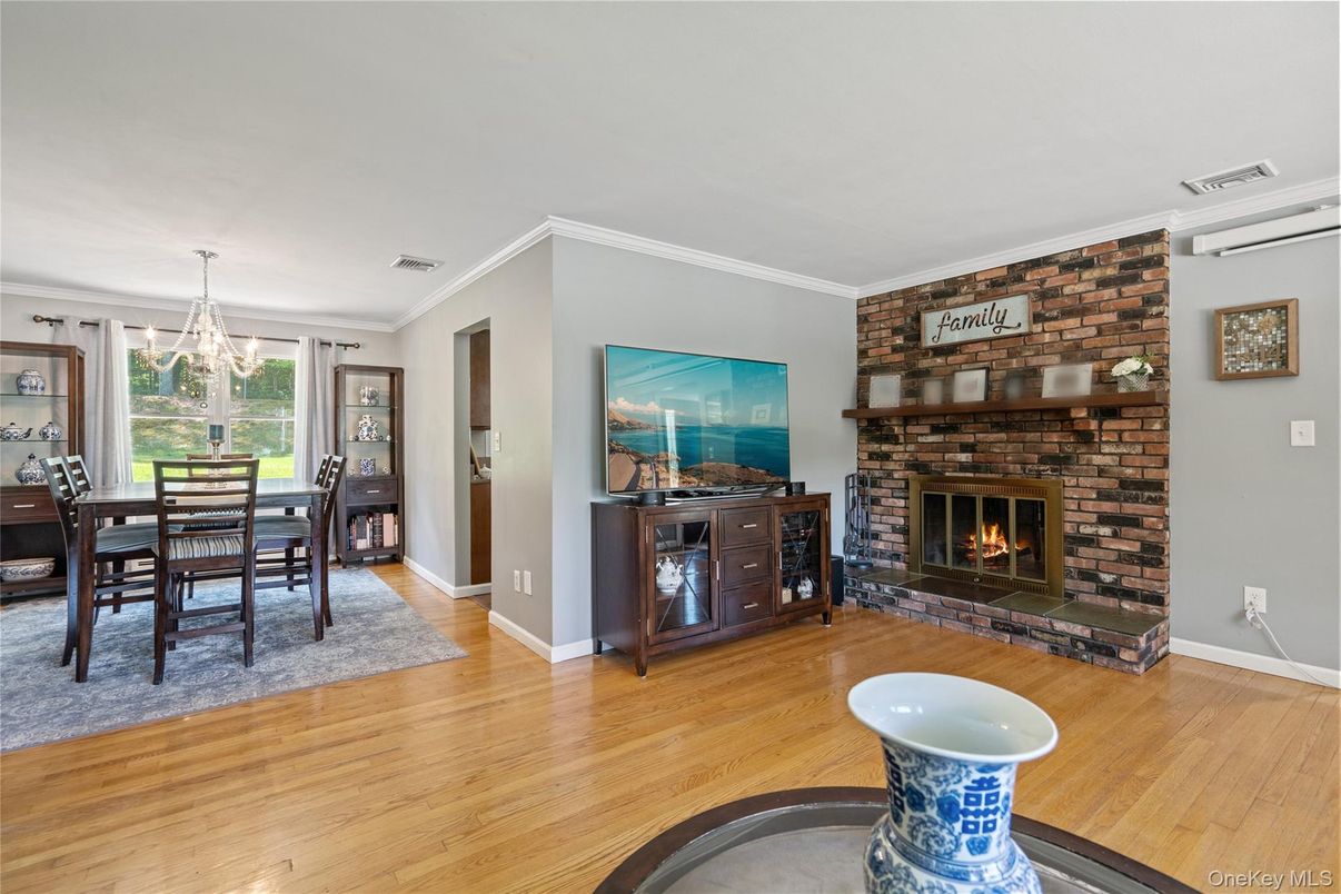 Dining room, Fireplace, Interior, Pendant Lights, Stone Walls, Wood Texture Flooring