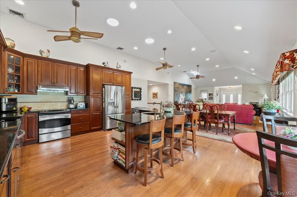 Dining room, Interior, Kitchen, Living room, Recessed Lighting, Stainless Steel Appliances, Wood Texture Flooring