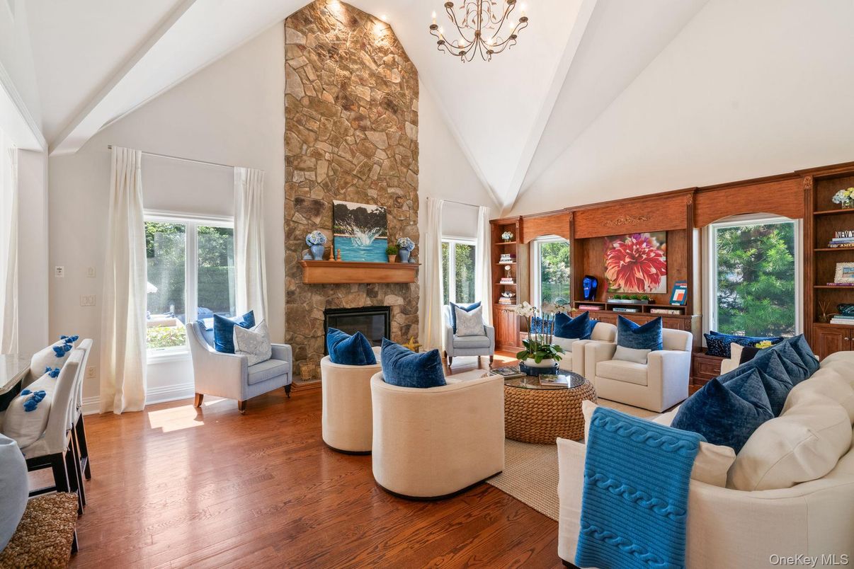 Chandelier, Fireplace, Interior, Living room, Stone Walls, Wood Texture Flooring
