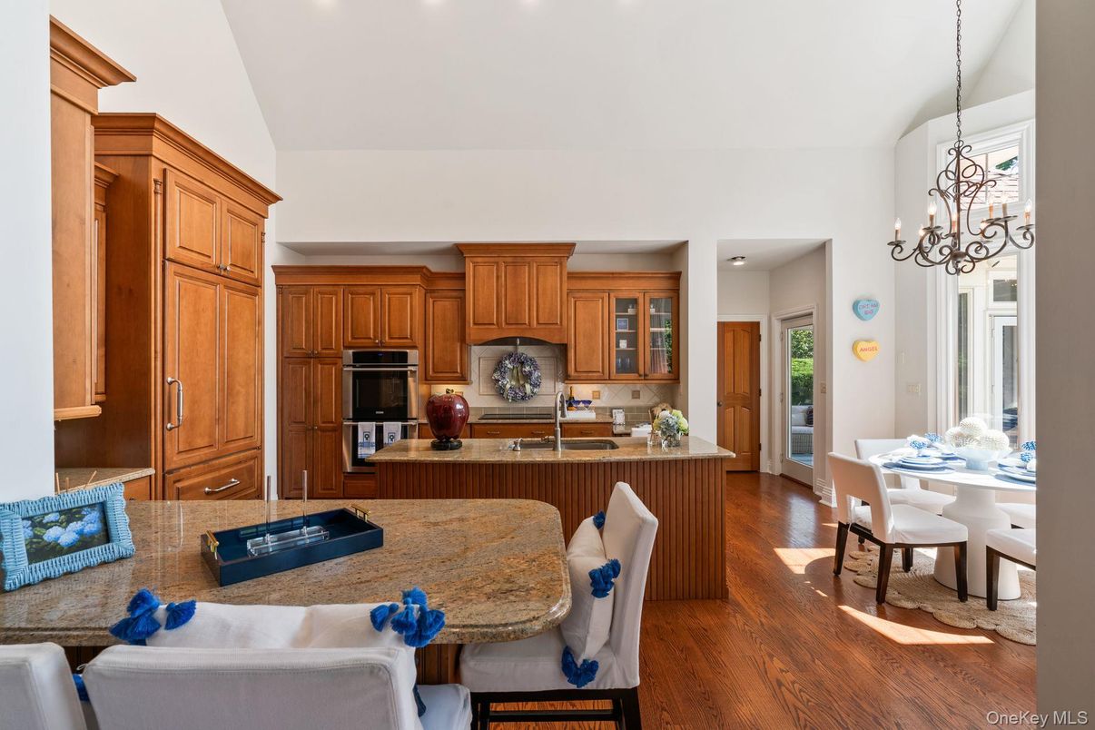 Chandelier, Dining room, Interior, Kitchen, Living room, Recessed Lighting, Stainless Steel Appliances, Wood Texture Flooring