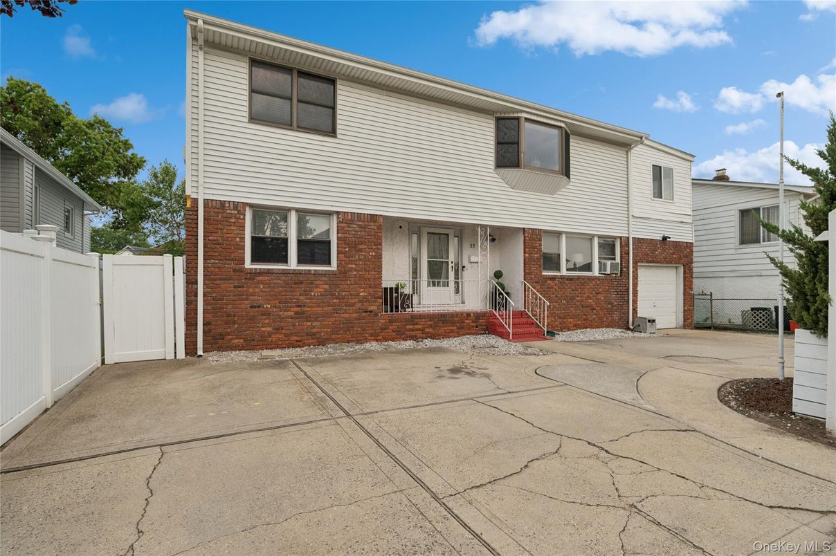 Attached, Exterior, Facade, Brick Facade, Raised Ranch